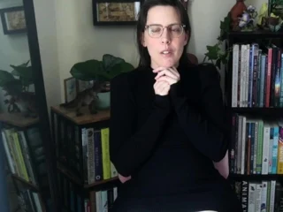 Small titted brunette Sharron with glasses masturbates